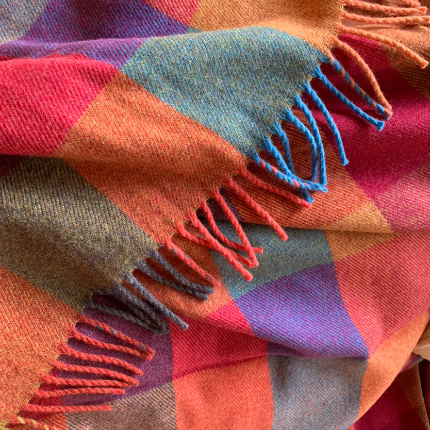 Orange, green, red and blue check wool throw
