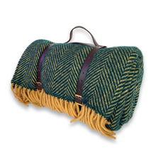 Green and mustard herringbone wool picnic blanket with waterproof backing and leather carry straps