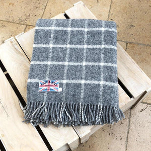 grey check wool throw in a conservatory