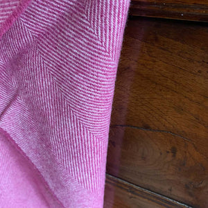 Edge of a mulberry pink merino lambswool throw