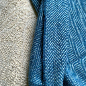 Herringbone pattern on a light blue wool throw
