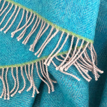Turquoise wool throw with green highlight and grey tassels