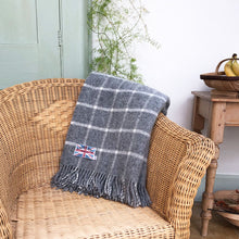 block check grey throw draped over a chair
